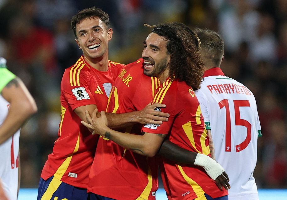 Spain's Marc Cucurella celebrates scoring their second goal with Martin Zubimendi and Nico Williams REUTERS/Stoyan Nenov